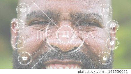 Smiling mature man displaying HUD overlay on face in garden, showing laptop icon and vertical icons Smiling mature man displaying HUD overlay on face in garden, showing laptop icon and vertical icons 141550051
