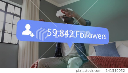 Sitting man reaching in bedroom with white VR headset and plaid shirt with 59,842 Followers overlay Sitting man reaching in bedroom with white VR headset and plaid shirt with 59,842 Followers overlay 141550052