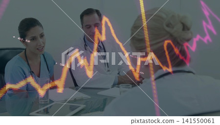 Discussing clinicians in scrubs and coats sitting at clinic using tablet stethoscope neon overlays Discussing clinicians in scrubs and coats sitting at clinic using tablet stethoscope neon overlays 141550061