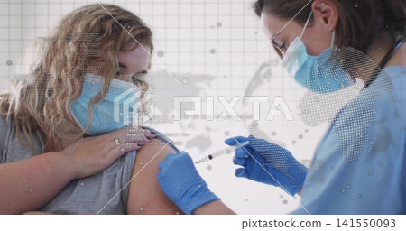 Administering clinician injecting female patient upper arm at clinic with syringe and gray top Administering clinician injecting female patient upper arm at clinic with syringe and gray top 141550093