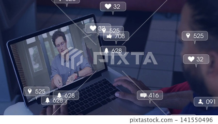 Watching red-shirted viewer using laptop on lap at home, showing light-blue presenter and overlays 141550496