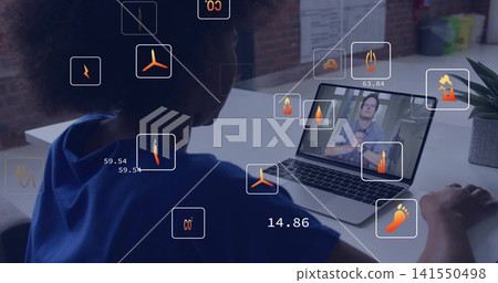 Watching woman wearing blue top at desk, viewing presenter on laptop with mouse, floating eco icons Watching woman wearing blue top at desk, viewing presenter on laptop with mouse, floating eco icons 141550498