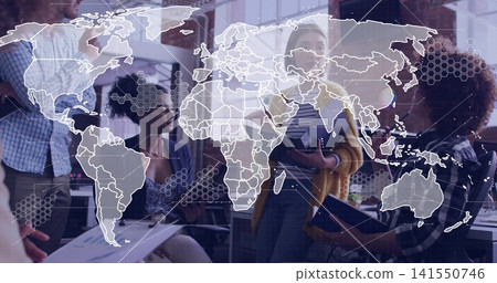 Leading woman in mustard cardigan guiding team in open office with world map overlay and laptops Leading woman in mustard cardigan guiding team in open office with world map overlay and laptops 141550746