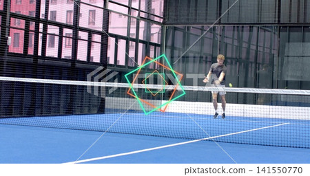 Swinging male wearing dark tee hitting yellow ball with racket, blue court net, overlay, copy space Swinging male wearing dark tee hitting yellow ball with racket, blue court net, overlay, copy space 141550770