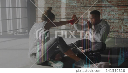 Pressing palms trainer and athletic trainee reaching in boxing ring ropes, red wraps, chart overlay Pressing palms trainer and athletic trainee reaching in boxing ring ropes, red wraps, chart overlay 141550818
