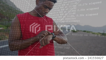 Man in red sleeveless athletic top checking wrist smartwatch on gravel shore road, terminal overlay Man in red sleeveless athletic top checking wrist smartwatch on gravel shore road, terminal overlay 141550827