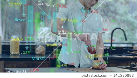 Pouring man in light shirt filling cup from teapot at kitchen counter with financial charts Pouring man in light shirt filling cup from teapot at kitchen counter with financial charts 141550898