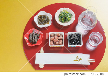 Japanese sake (chilled) and Japanese food, half-moon shaped tray and chopstick wrapper with the character for "longevity" | Gold background 141551086