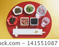 Japanese sake (chilled) and Japanese food, half-moon shaped tray and chopstick wrapper with the character for "longevity" | Gold background Japanese sake (chilled) and Japanese food, half-moon shaped tray and chopstick wrapper with the character for "longevity" | Gold background 141551087