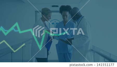 Discussing clinical team in lab coats, blue scrubs, reviewing charts in hospital corridor with ECG Discussing clinical team in lab coats, blue scrubs, reviewing charts in hospital corridor with ECG 141551177
