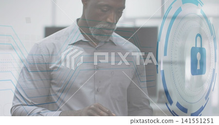 Interacting mature man in light shirt tapping tablet at office with padlock icon and circuits Interacting mature man in light shirt tapping tablet at office with padlock icon and circuits 141551251
