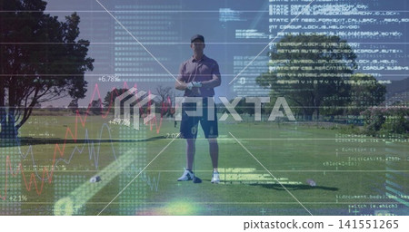 Standing golfer in polo and glove holding club vertical on tee with ball and data overlays Standing golfer in polo and glove holding club vertical on tee with ball and data overlays 141551265