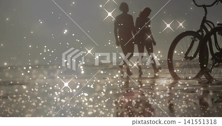 Walking two silhouetted men barefoot on wet sand at low-tide, with bike silhouette and star sparkle Walking two silhouetted men barefoot on wet sand at low-tide, with bike silhouette and star sparkle 141551318