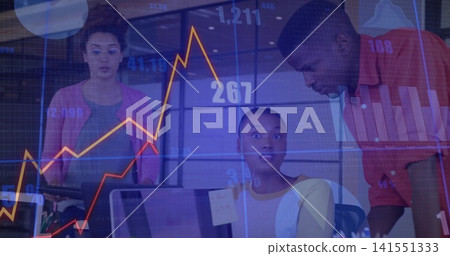 Analyzing seated woman in light yellow reviewing data at office, with monitors and overlaid charts 141551333