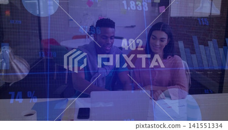 Reviewing man in teal shirt, woman in pink blouse analyzing charts on laptop at office table Reviewing man in teal shirt, woman in pink blouse analyzing charts on laptop at office table 141551334