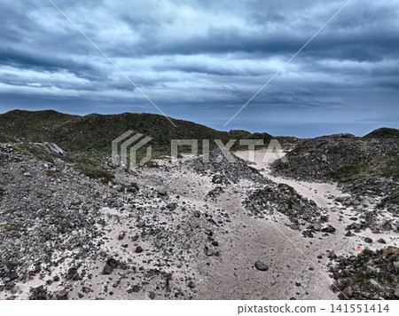 Aerial photograph capturing the wilderness of the desert behind Mt. Tenjo on Kozushima Island, Tokyo. Aerial photograph capturing the wilderness of the desert behind Mt. Tenjo on Kozushima Island, Tokyo. 141551414