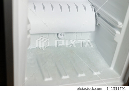 Opened empty white freezer drawer shelf close up Opened empty white freezer drawer shelf close up 141551791