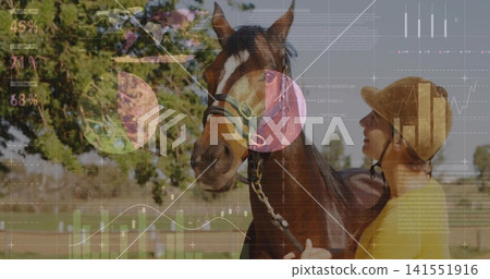 Standing bay horse, handler wearing helmet, yellow top holding lead in paddock, overlaid charts Standing bay horse, handler wearing helmet, yellow top holding lead in paddock, overlaid charts 141551916