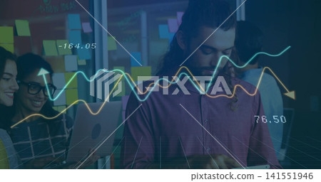 Holding tablet, man wearing shirt analyzing data overlays at office with sticky notes, laptop Holding tablet, man wearing shirt analyzing data overlays at office with sticky notes, laptop 141551946