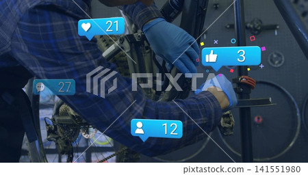 Fixing tech in blue-plaid shirt wearing nitrile gloves adjusting crankset in workshop, social icons Fixing tech in blue-plaid shirt wearing nitrile gloves adjusting crankset in workshop, social icons 141551980