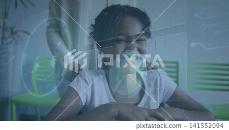 Smiling girl in short-sleeve tee leaning on desk, adult placing hands with wristwatch at home, HUD Smiling girl in short-sleeve tee leaning on desk, adult placing hands with wristwatch at home, HUD 141552094