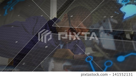 Leaning mid-adult man wearing suit, tie, eyeglasses examining holographic overlays at office table Leaning mid-adult man wearing suit, tie, eyeglasses examining holographic overlays at office table 141552131