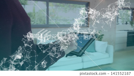Holding woman in dark sweater tapping tablet in modern living room, digital overlay, copy space 141552187