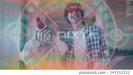 Adjusting cone party hat, two women posing in decorated room with novelty glasses and plaid shirt Adjusting cone party hat, two women posing in decorated room with novelty glasses and plaid shirt 141552252