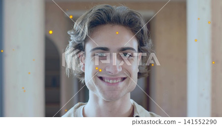 Smiling adult man leaning in home, wearing light collared shirt, posts, arched doorway, warm bokeh Smiling adult man leaning in home, wearing light collared shirt, posts, arched doorway, warm bokeh 141552290