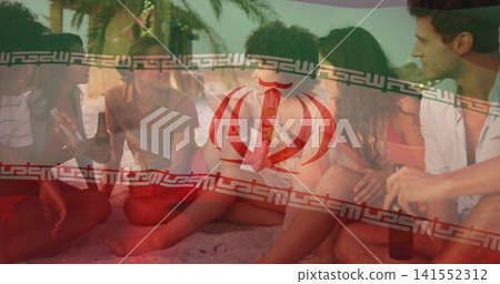Sitting six adults talking on beach sand by palms, holding bottles, wearing swimwear, flag overlay Sitting six adults talking on beach sand by palms, holding bottles, wearing swimwear, flag overlay 141552312