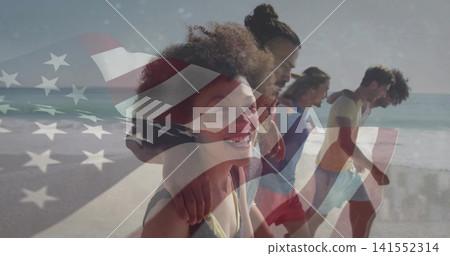 Walking seven friends wearing beachwear linking arms along sandy beach, with American flag overlay Walking seven friends wearing beachwear linking arms along sandy beach, with American flag overlay 141552314