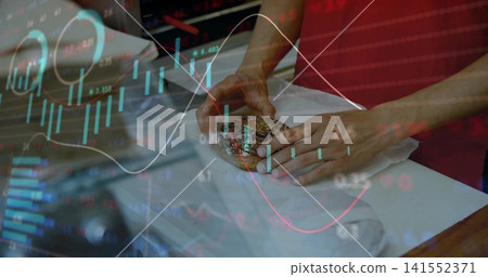 Wrapping worker's hands folding seeded roll in paper on counter, in red shirt with chart overlay Wrapping worker's hands folding seeded roll in paper on counter, in red shirt with chart overlay 141552371
