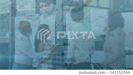 Collaborating colleagues reviewing charts in meeting room in business attire, with glass partition 141552544