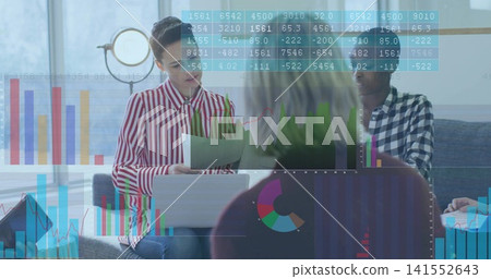 Reviewing charts, colleagues meeting in office lounge, woman in striped top holding pages, laptop Reviewing charts, colleagues meeting in office lounge, woman in striped top holding pages, laptop 141552643