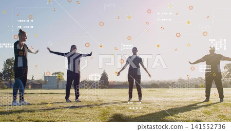 Stretching four women performing arm extensions on grassy field in dark sportswear with HUD overlay Stretching four women performing arm extensions on grassy field in dark sportswear with HUD overlay 141552736