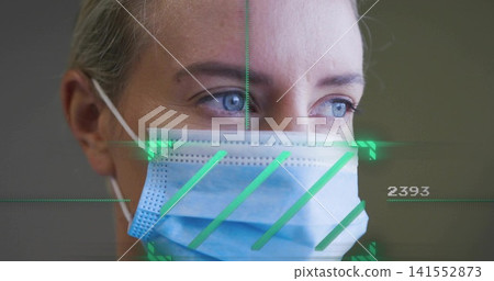 Looking mid-adult woman wearing blue surgical mask, focusing eyes right in clinical room, HUD 2393 141552873