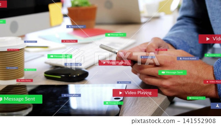 Tapping adult hands in blue shirt holding phone over wooden desk, with keyboard, alerts, copy space Tapping adult hands in blue shirt holding phone over wooden desk, with keyboard, alerts, copy space 141552908