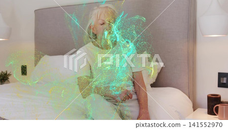 Sitting senior woman wearing light sleepwear resting on bed in bedroom, with green aqua swirl 141552970