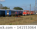 Blue train cars destined for disposal, which were being held at Akita Port. 141553064