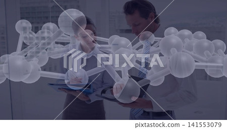 Examining pair in business wear consulting tablet and folder by highrise windows, molecular overlay Examining pair in business wear consulting tablet and folder by highrise windows, molecular overlay 141553079