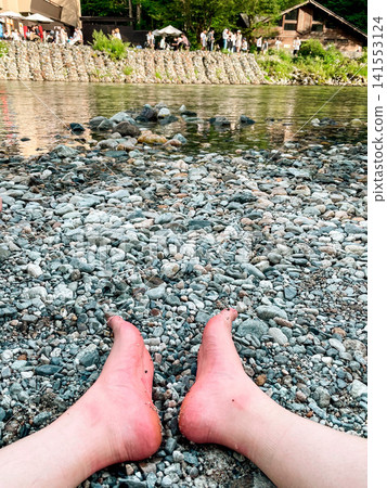 Barefoot resting at Kappa Bridge in Kamikochi Barefoot resting at Kappa Bridge in Kamikochi 141553124
