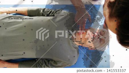 Doing airway-maneuver rescuer placing hands on man in olive-top on blue-mat in clinic halftone code Doing airway-maneuver rescuer placing hands on man in olive-top on blue-mat in clinic halftone code 141553337