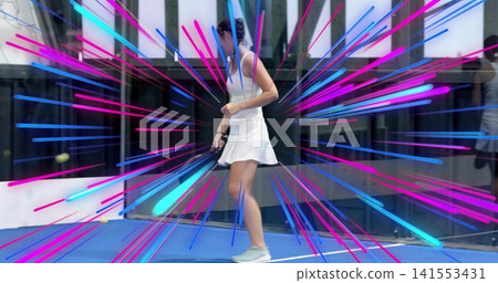 Moving player in white tennis dress holding paddle on glass court with yellow balls, magenta burst Moving player in white tennis dress holding paddle on glass court with yellow balls, magenta burst 141553431