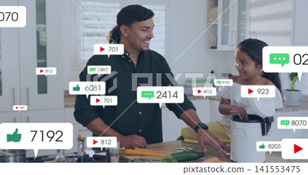 Chopping green-shirt dad as yellow-apron child using multicooker at island with knife and overlays Chopping green-shirt dad as yellow-apron child using multicooker at island with knife and overlays 141553475