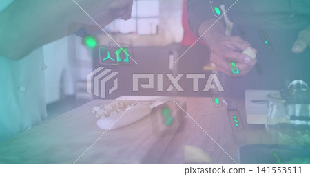 Preparing garlic on wooden board in kitchen, chef jacket red apron hands showing green AR icons Preparing garlic on wooden board in kitchen, chef jacket red apron hands showing green AR icons 141553511