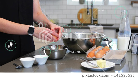 Woman wearing sleeveless top, watch cracking egg into bowl in kitchen with AR overlays, copy space Woman wearing sleeveless top, watch cracking egg into bowl in kitchen with AR overlays, copy space 141553555
