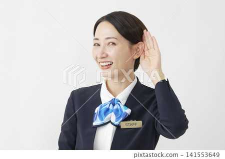 Middle-aged female staff member, listening pose, white background. Middle-aged female staff member, listening pose, white background. 141553649