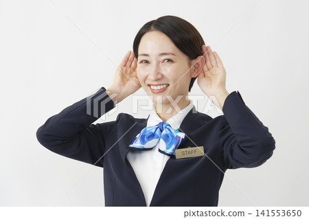 Middle-aged female staff member, listening pose, white background. 141553650
