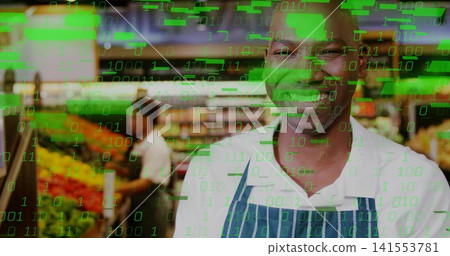 Smiling clerk in striped apron arranging produce in store aisle with green code overlay, copy space Smiling clerk in striped apron arranging produce in store aisle with green code overlay, copy space 141553781
