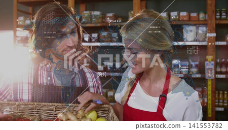 Inspecting staff checking basket produce in shop wearing aprons holding blue-pen digital-overlay Inspecting staff checking basket produce in shop wearing aprons holding blue-pen digital-overlay 141553782